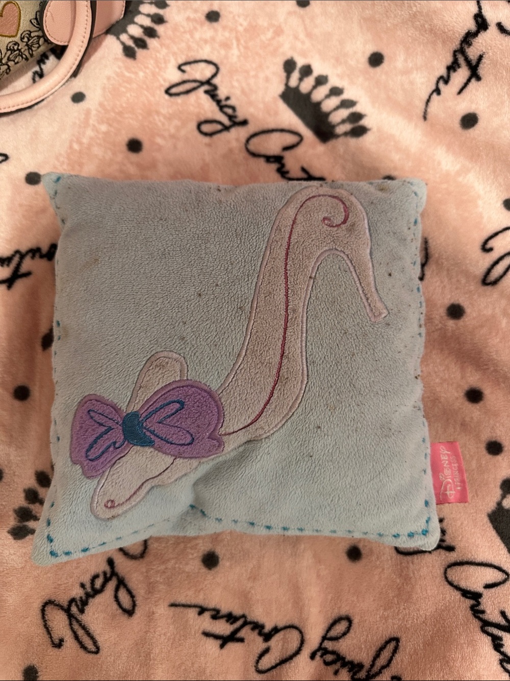 Disney light blue plush pillow with purple bow and cream swan applique